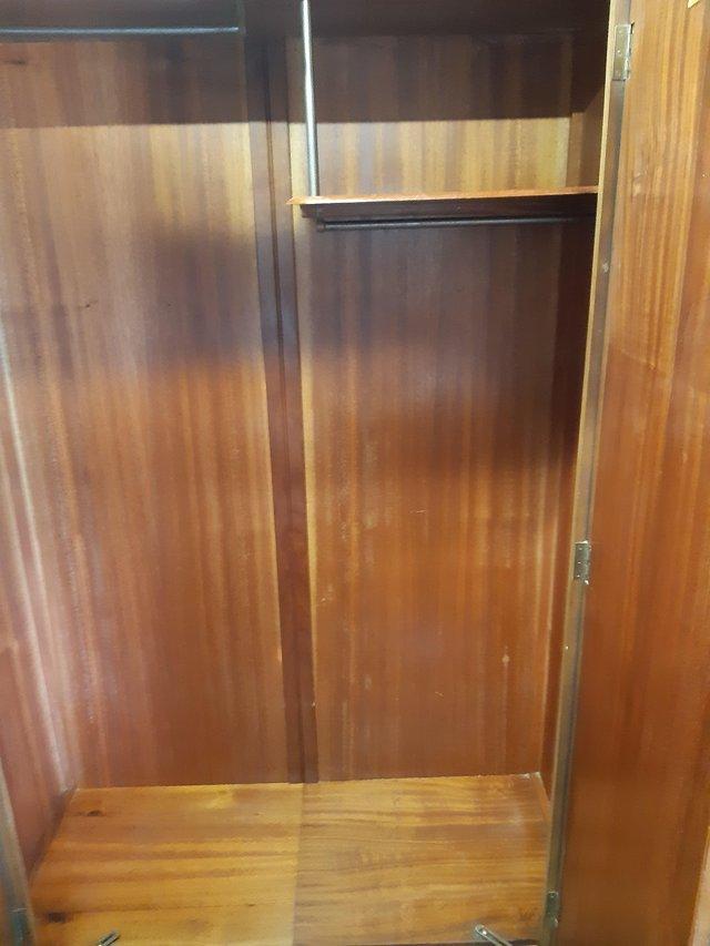 Preview of the first image of Solid Brown Wood Double Wardrobe.
