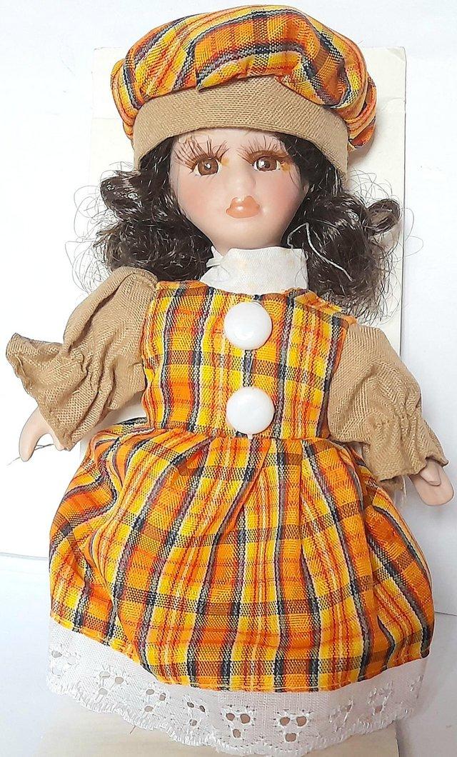 Preview of the first image of PORCELAIN BOXED DOLL - BONNIE - TARTAN OUTFIT 16 cm.