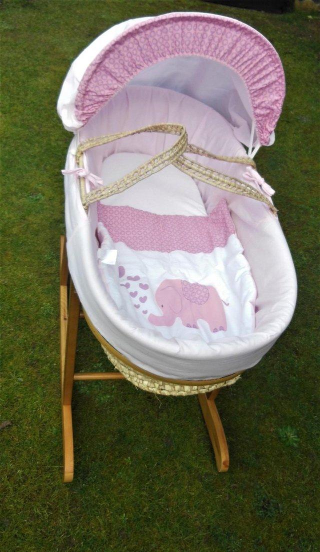 Preview of the first image of MOSES BASKET IN PINK WITH ROCKING STAND..
