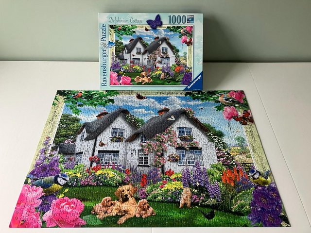 Preview of the first image of Ravensburger 1000 piece jigsaw titled Delphinium Cottage..
