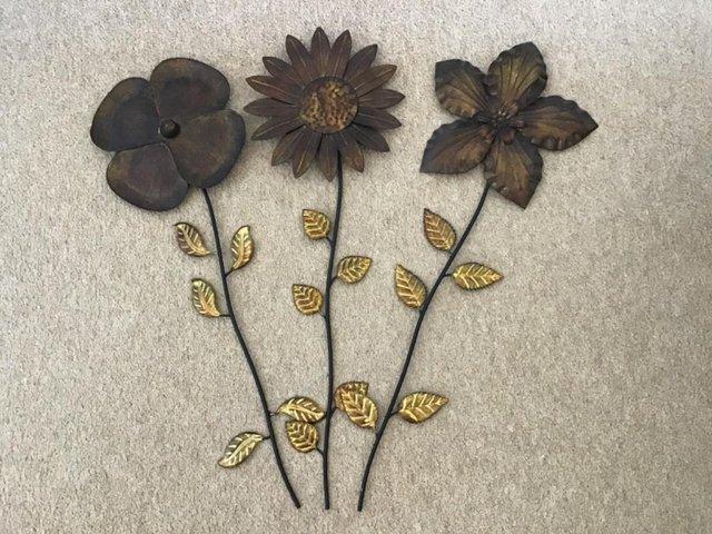 Preview of the first image of Three Metal Wall Hanging Flowers..