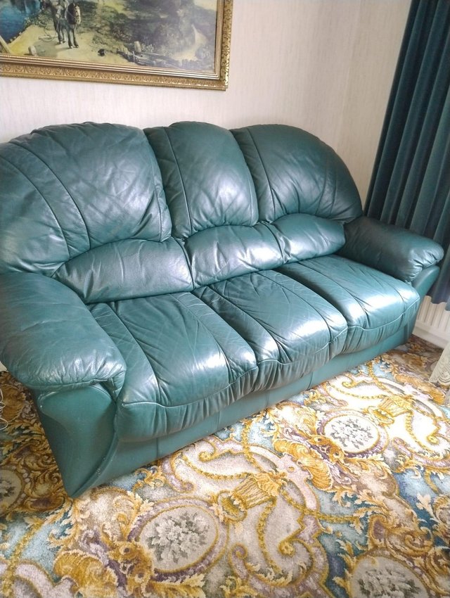 Preview of the first image of Green leather three seater settee.