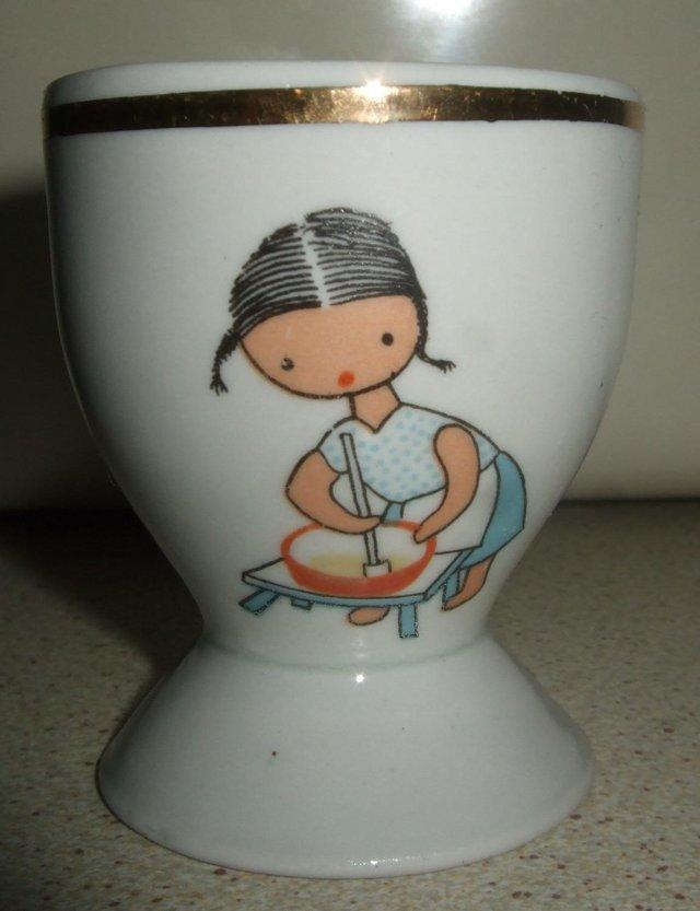 Preview of the first image of ChedziezMade in Poland Footed Egg Cup with Girl on the Front.