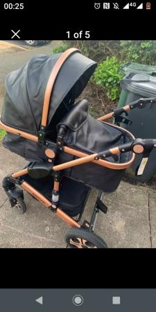 Image 3 of BLACK AND GOLD PUSHCHAIR