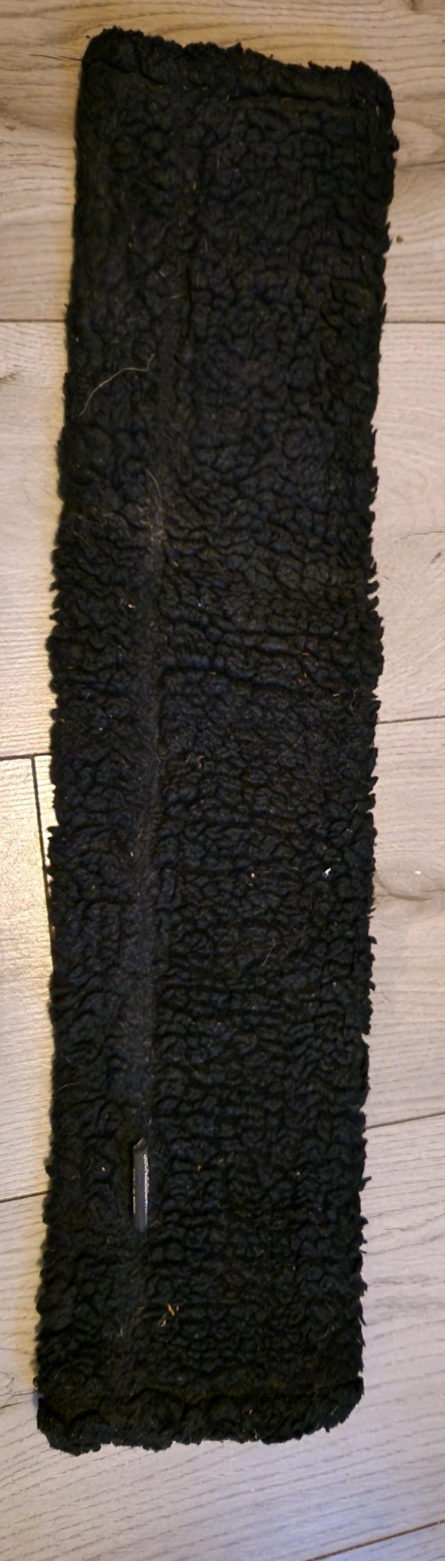 Preview of the first image of Black shires sheepskin girth sleeve.