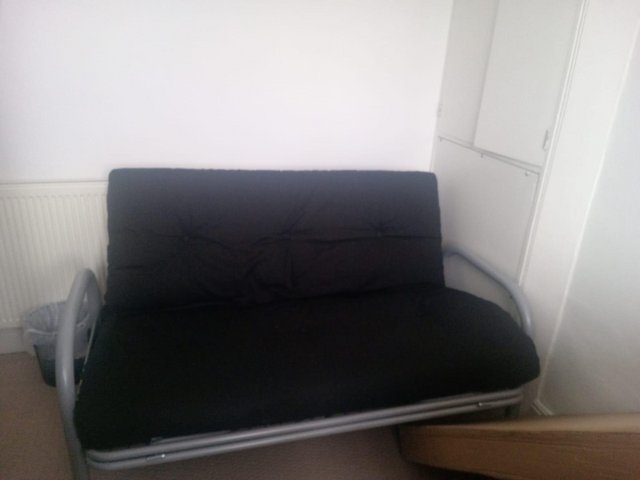 Preview of the first image of Black sofa bed sleeps 2 excellent condition.