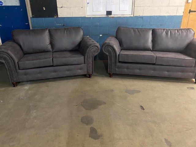 Preview of the first image of Oakland 3&2 sofas in grey Reno fabric.