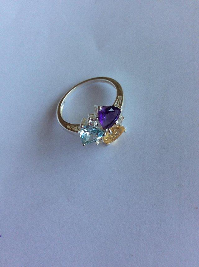 Preview of the first image of Unusual three stone silver dress ring.