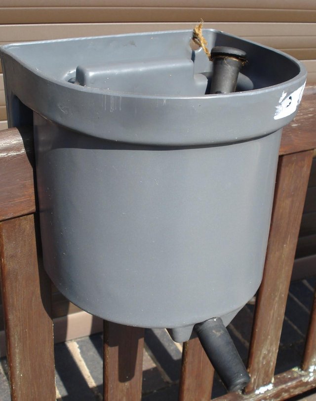Preview of the first image of CALF FEEDING BUCKET AS NEW.