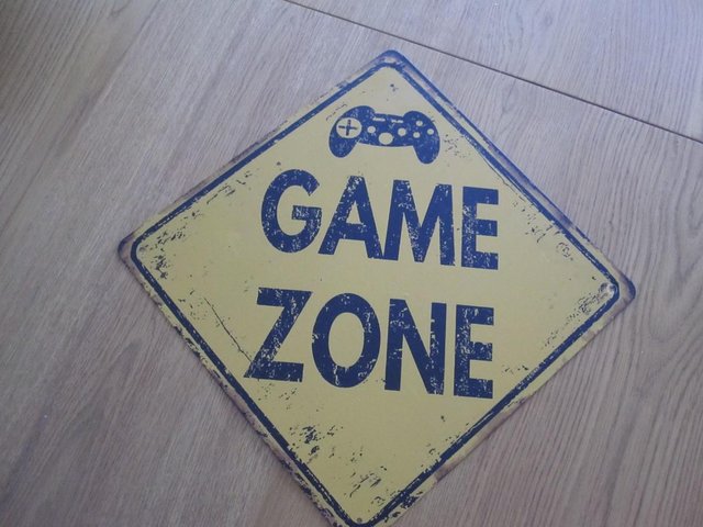 Preview of the first image of Game zone metal street sign.