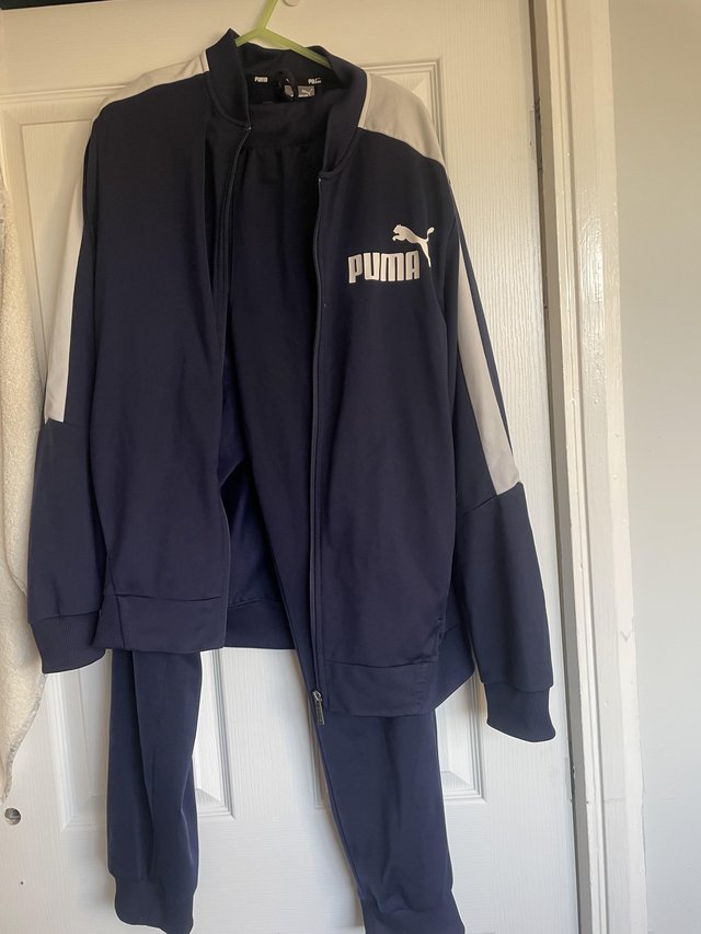 Preview of the first image of 2 x puma tracksuits size medium.