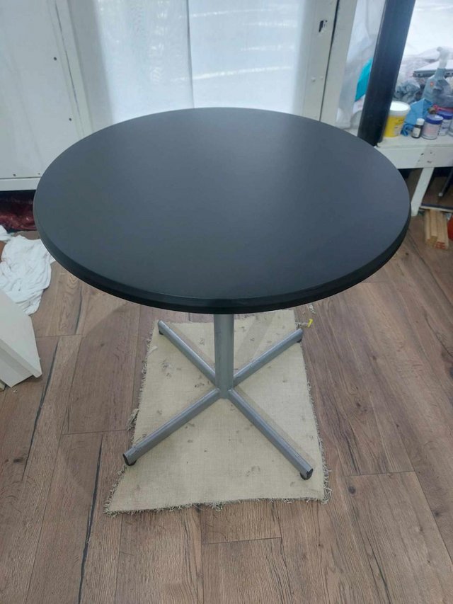 Preview of the first image of Upcycled black top occasional table.