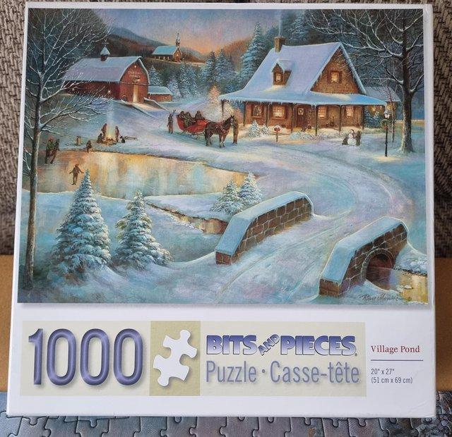 Preview of the first image of 1000 piece jigsaw called VILLAGE POND by BITS and PIECES.