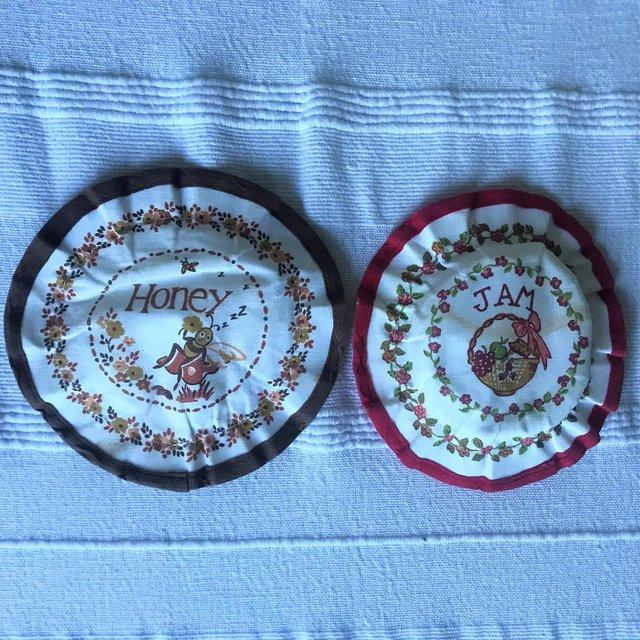 Preview of the first image of Vintage 1970's M&S jam & honey pot covers. TLC. £1 both..