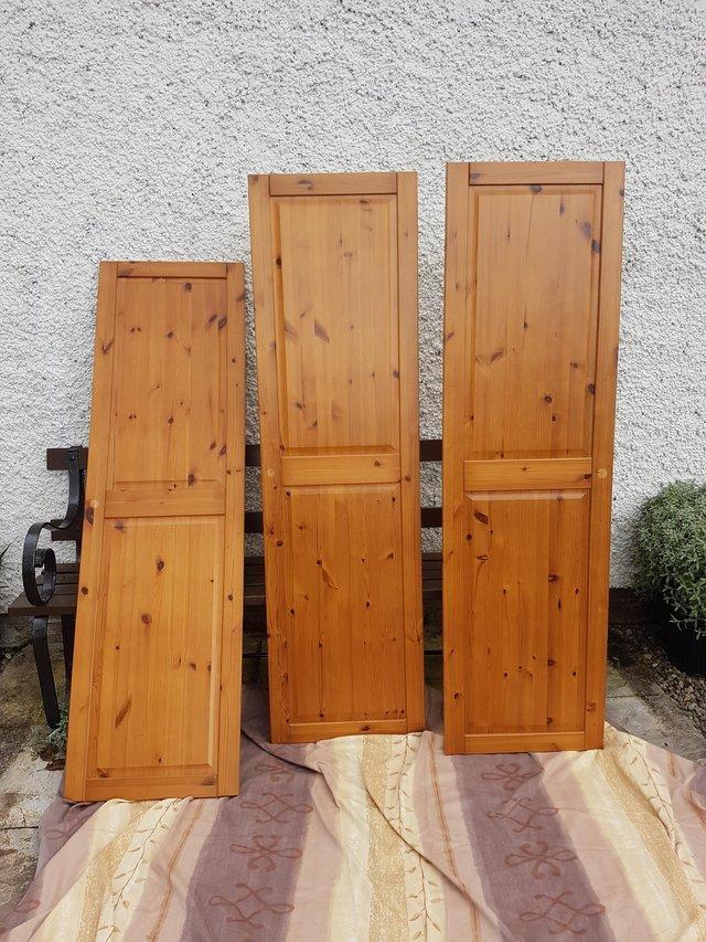 Preview of the first image of Pine effect wardrobe with triple pine wood doors.