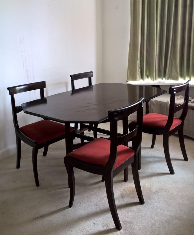 Folding dining-table with four upholstered chairs to match