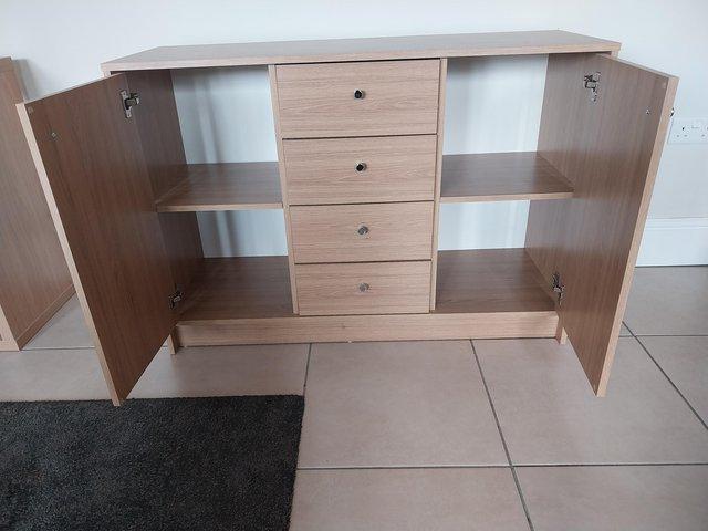 Preview of the first image of Oak effect 2 door 3 drawer sideboard.
