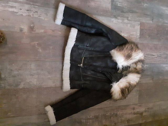 Preview of the first image of 2 ladies  faux fur coats  and one mock biker jacket.