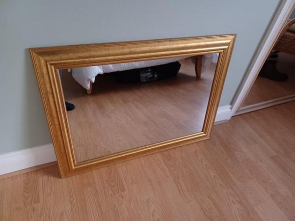 Image 1 of Wall mirror with gold type  surround