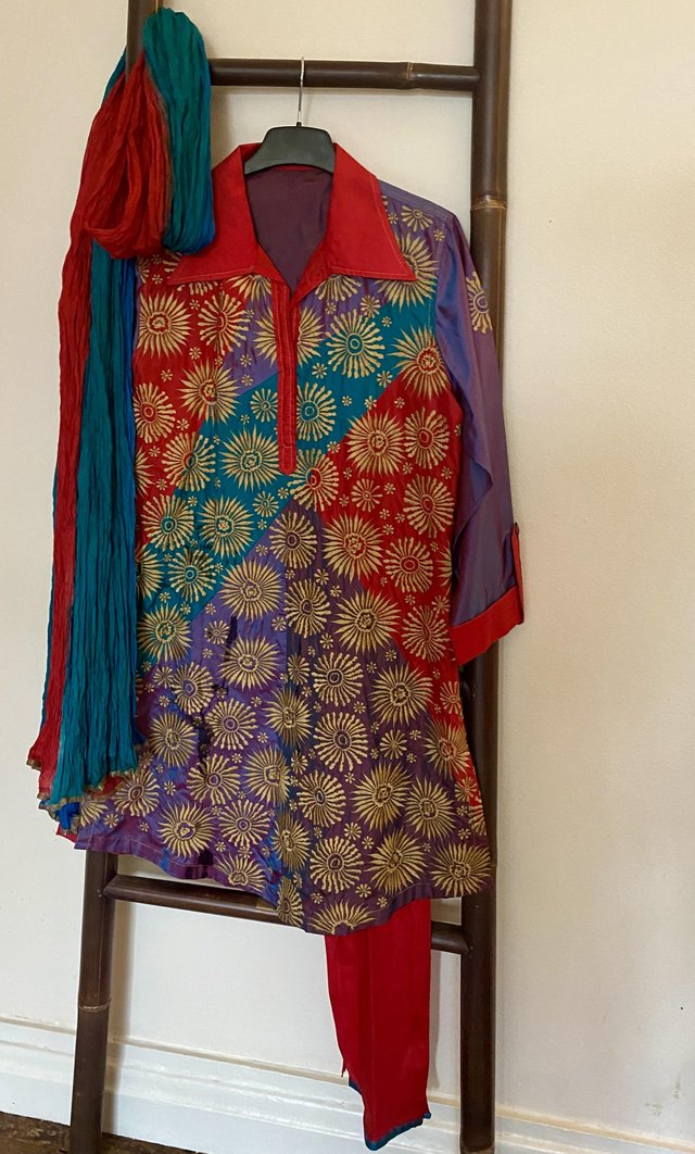 Preview of the first image of Red, purple, blue Indian churidar suit.
