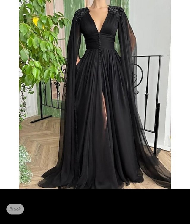 Preview of the first image of Size 24 black wedding dress.