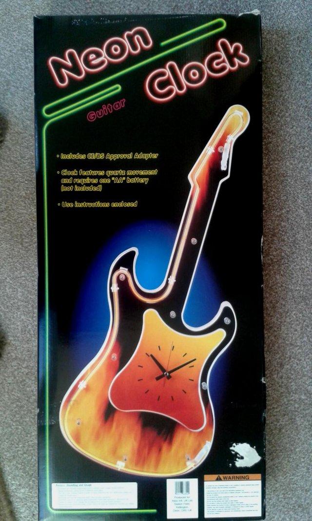 Preview of the first image of New  Neon Light Guitar Clock Design wall hanging.