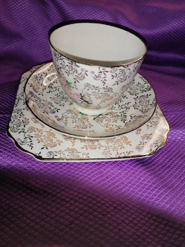 Preview of the first image of Delicate pink flower fine bone china 4-piece tea set.