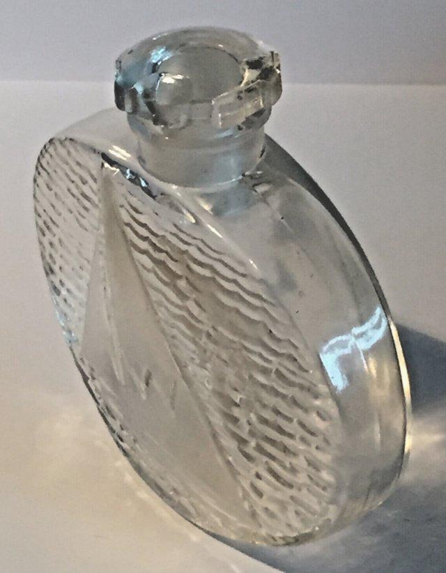 Preview of the first image of Lalique Clear Glass Iconic Sailboat Scent Perfume Bottle.