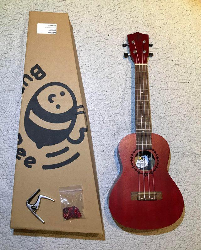 Preview of the first image of Brand New Ukulele, Picks and Capo.