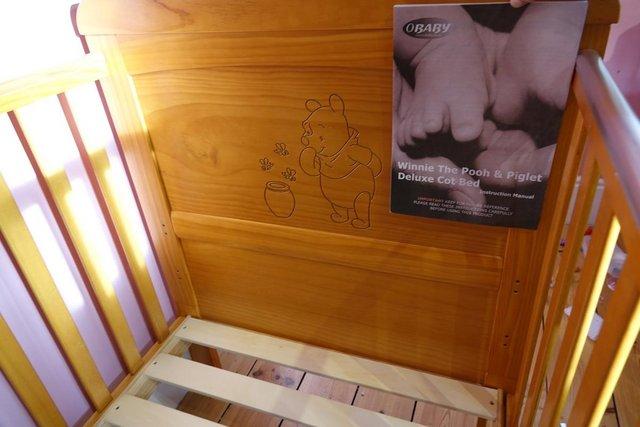 Preview of the first image of Winnie the Pooh & Piglet Deluxe cot bed.