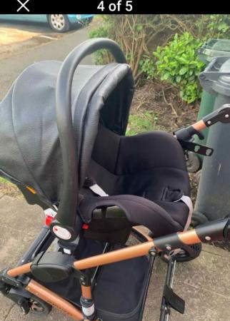Image 2 of BLACK AND GOLD PUSHCHAIR