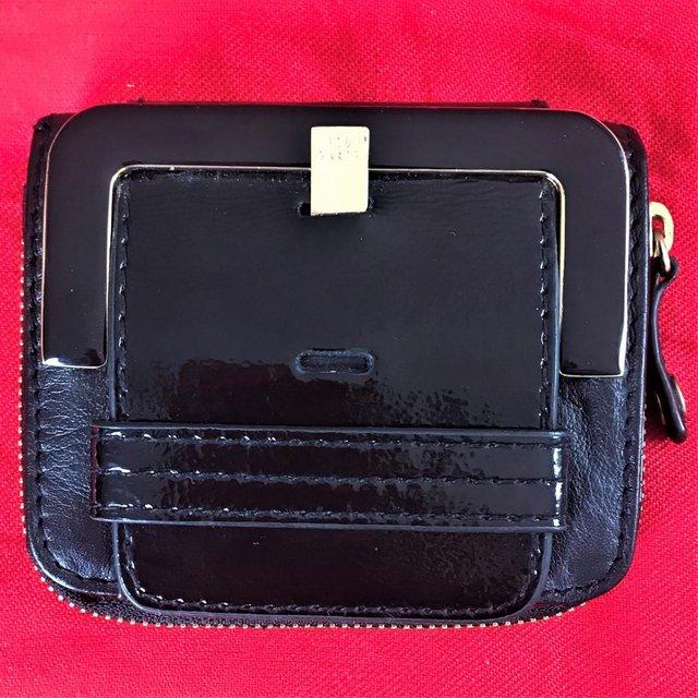 Preview of the first image of Unused Ted Baker purse wallet black leather/patent leather.