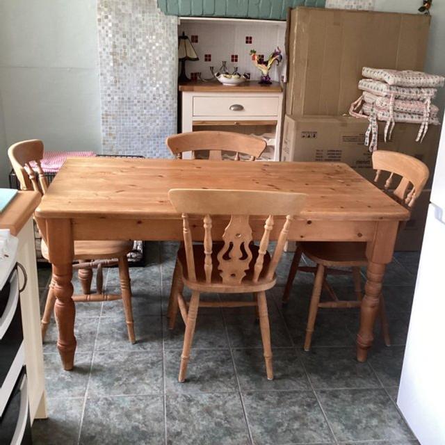 Preview of the first image of Secondhand solid pine kitchen table and four chairs.