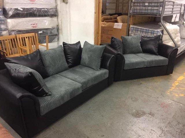 Preview of the first image of 3&2 Byron sofas in black snake with grey jumbo cord.