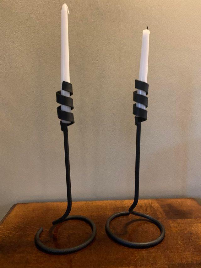 Preview of the first image of 2 Black forged iron candlesticks.
