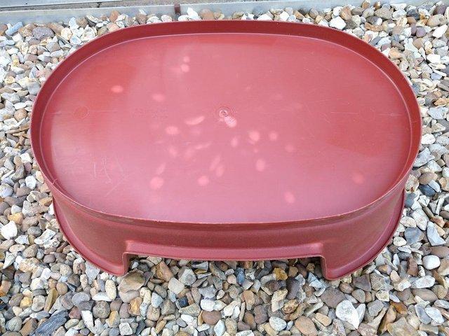 Preview of the first image of Small dark red plasic dog bed by HYWARE.