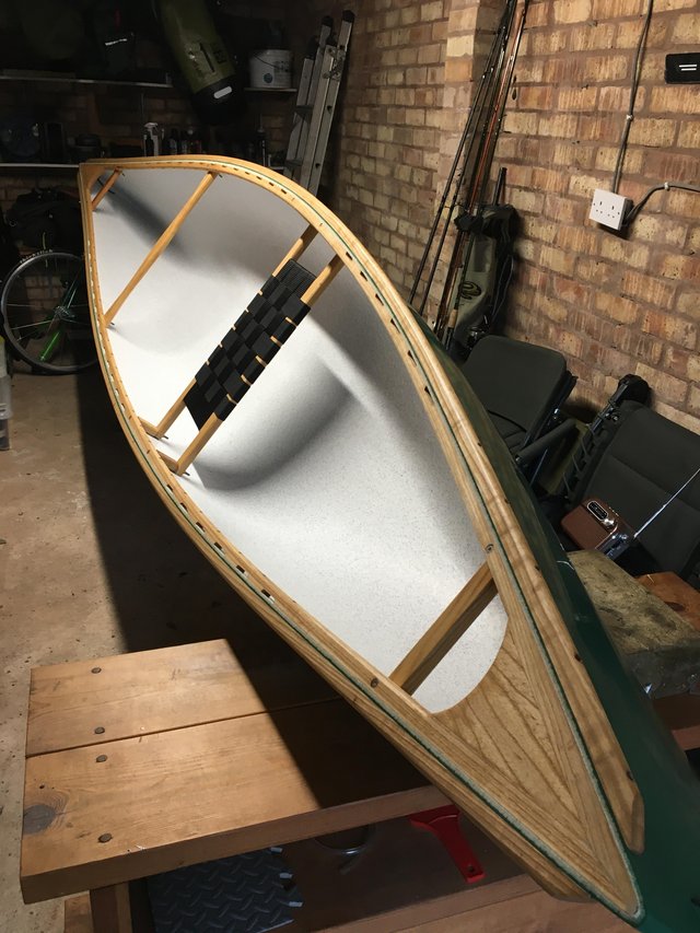 Preview of the first image of Solo canoe outfitted in ash wood.