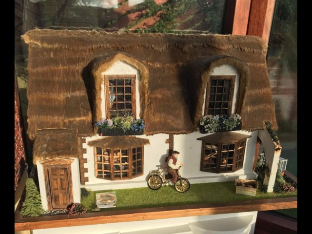 Preview of the first image of Thatched style cottage dolls house.