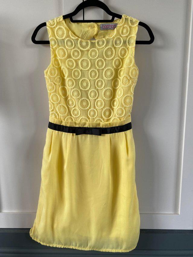 Preview of the first image of Boohoo yellow summer dress size 10.