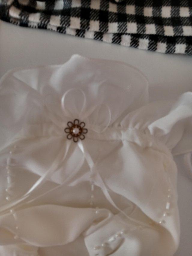 Preview of the first image of Wedding bridal dolly bag with detail..
