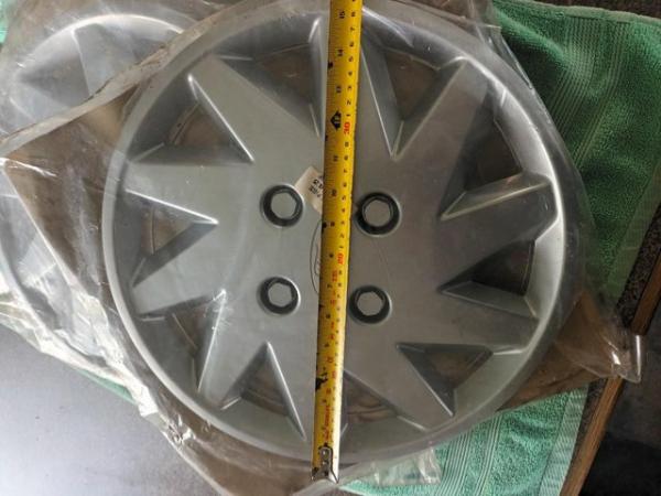 Image 7 of TWO ORIGINAL FORD WHEELS TRIMS.
