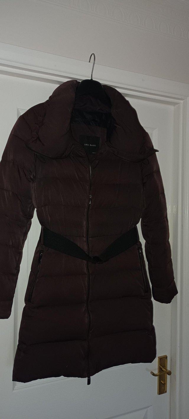 Preview of the first image of ZARA ladies quilted mid length coat.