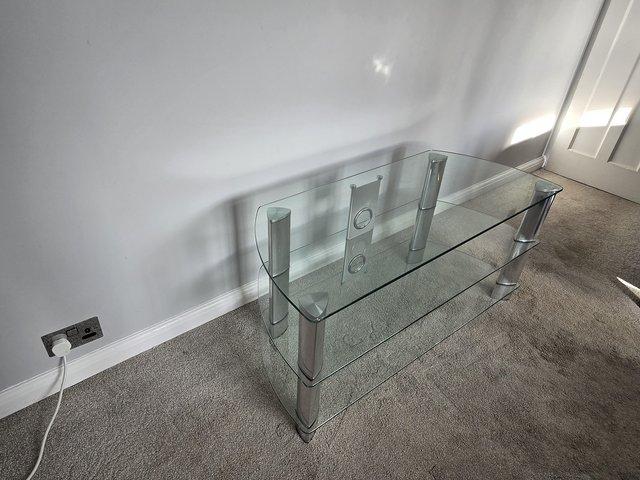 Preview of the first image of Glass TV Stand excellent conditon.