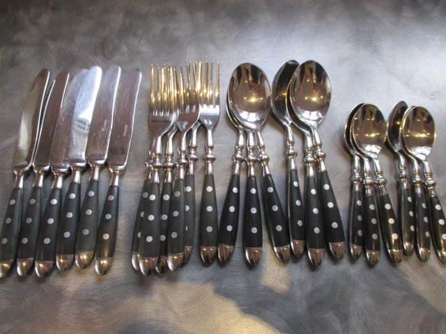 Preview of the first image of Attractive, sturdy black/silver handled cutlery set.