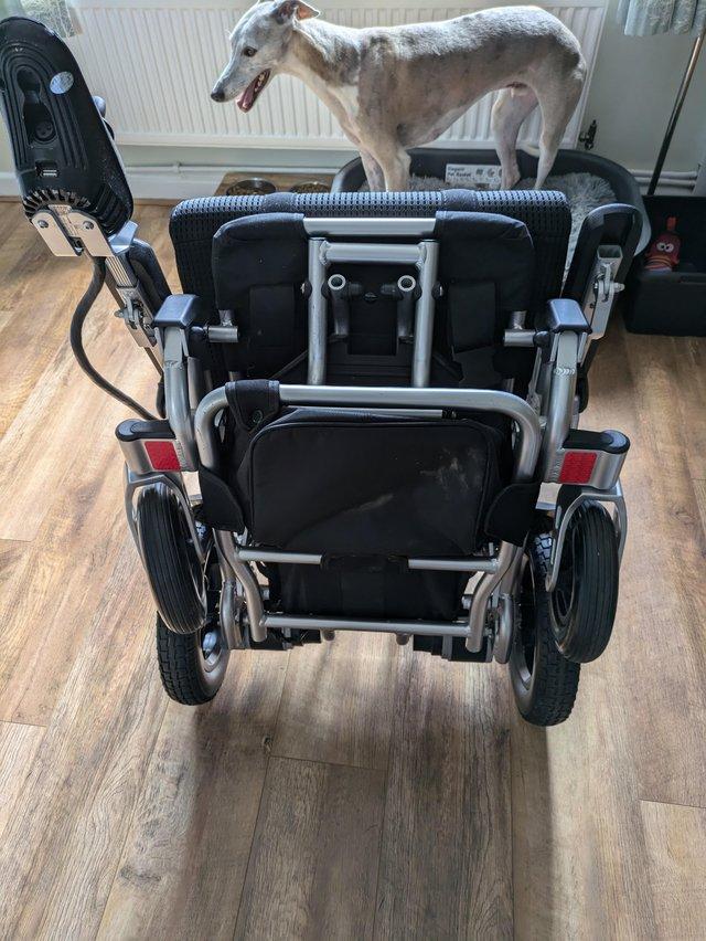 Preview of the first image of Electric wheelchair with carry bag for airplanes use.