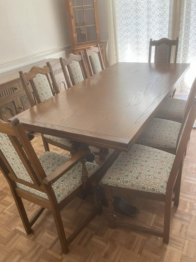 Preview of the first image of SOLID OAK VINTAGE TABLE AND CHAIRS WITH EIGHT CHAIRS.