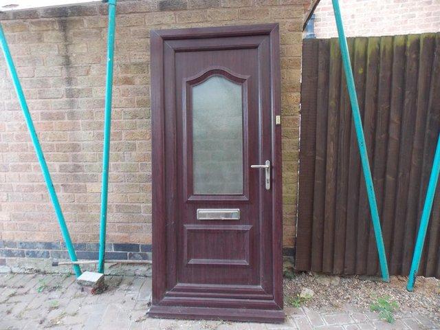 Preview of the first image of UPVC Rose Wood Front Door for sale.