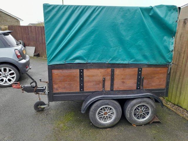 Preview of the first image of Twin wheeled  trailer with cover.