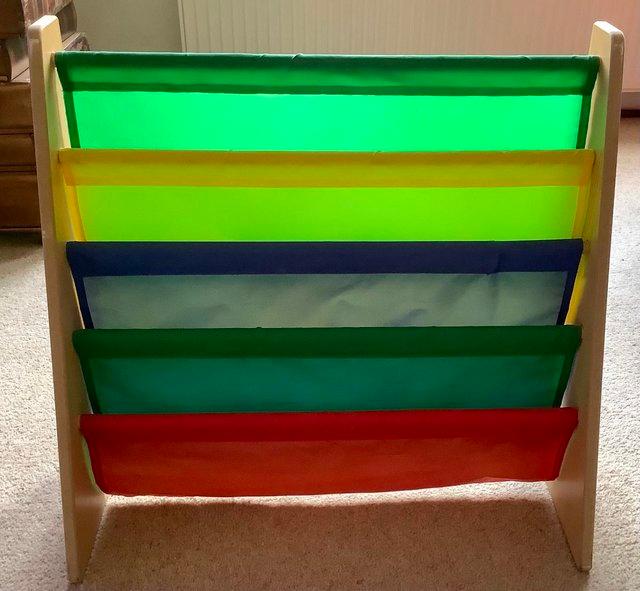 Preview of the first image of Colourful children’s sling pocket  bookcase.