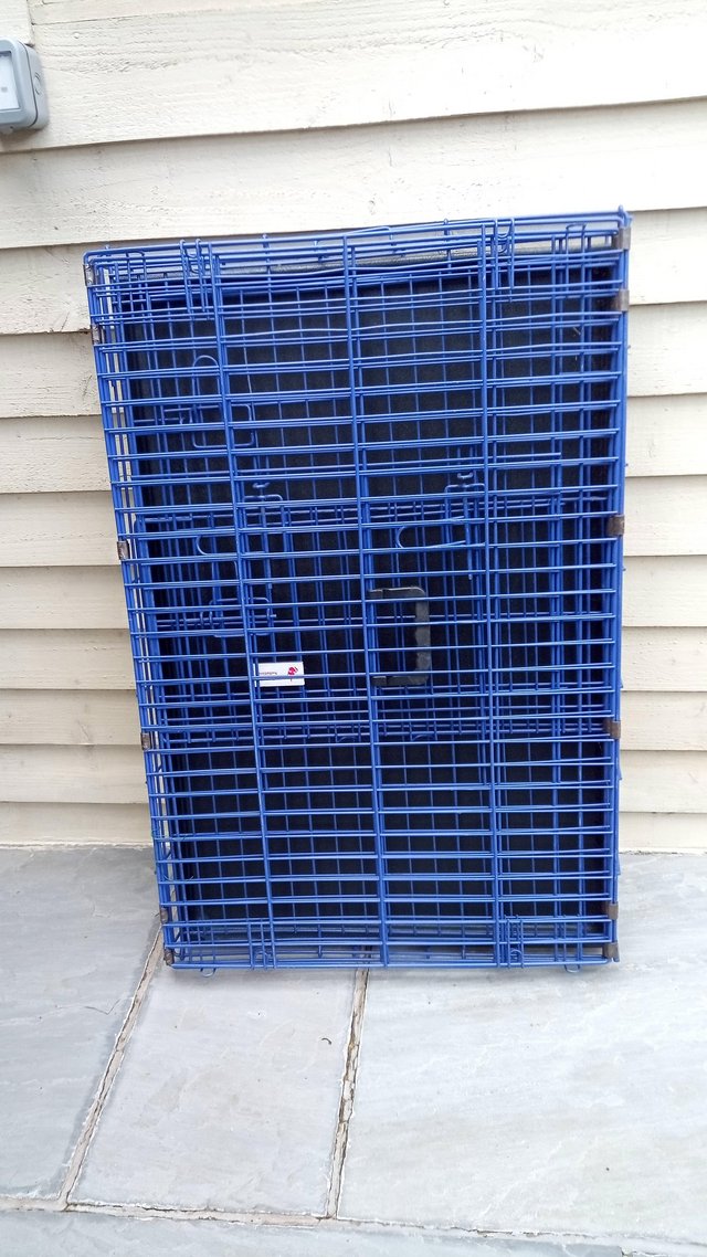 Preview of the first image of Foldable dog cage with two doors.